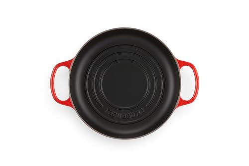 Le Creuset Bread Oven Cerise interior enamel cleans easily and requires no seasoning.