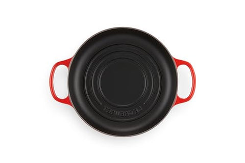 Le Creuset Bread Oven Cerise interior enamel cleans easily and requires no seasoning.