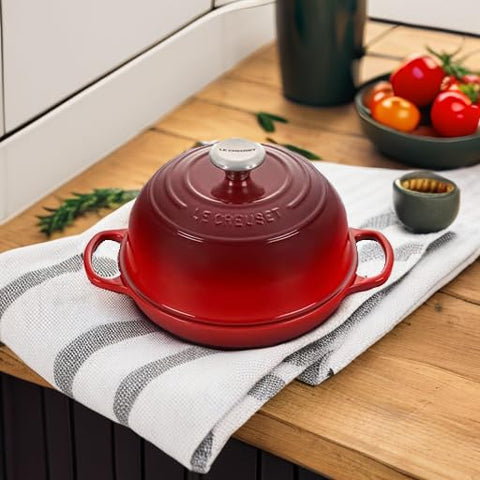 Le Creuset Bread Oven Cerise matte interior enamel develops patina to enhance baking performance.
