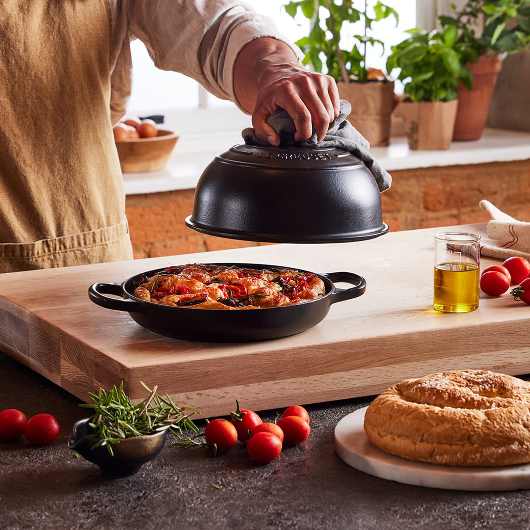Le Creuset enamel finish resists staining and sticking for easy cleaning.