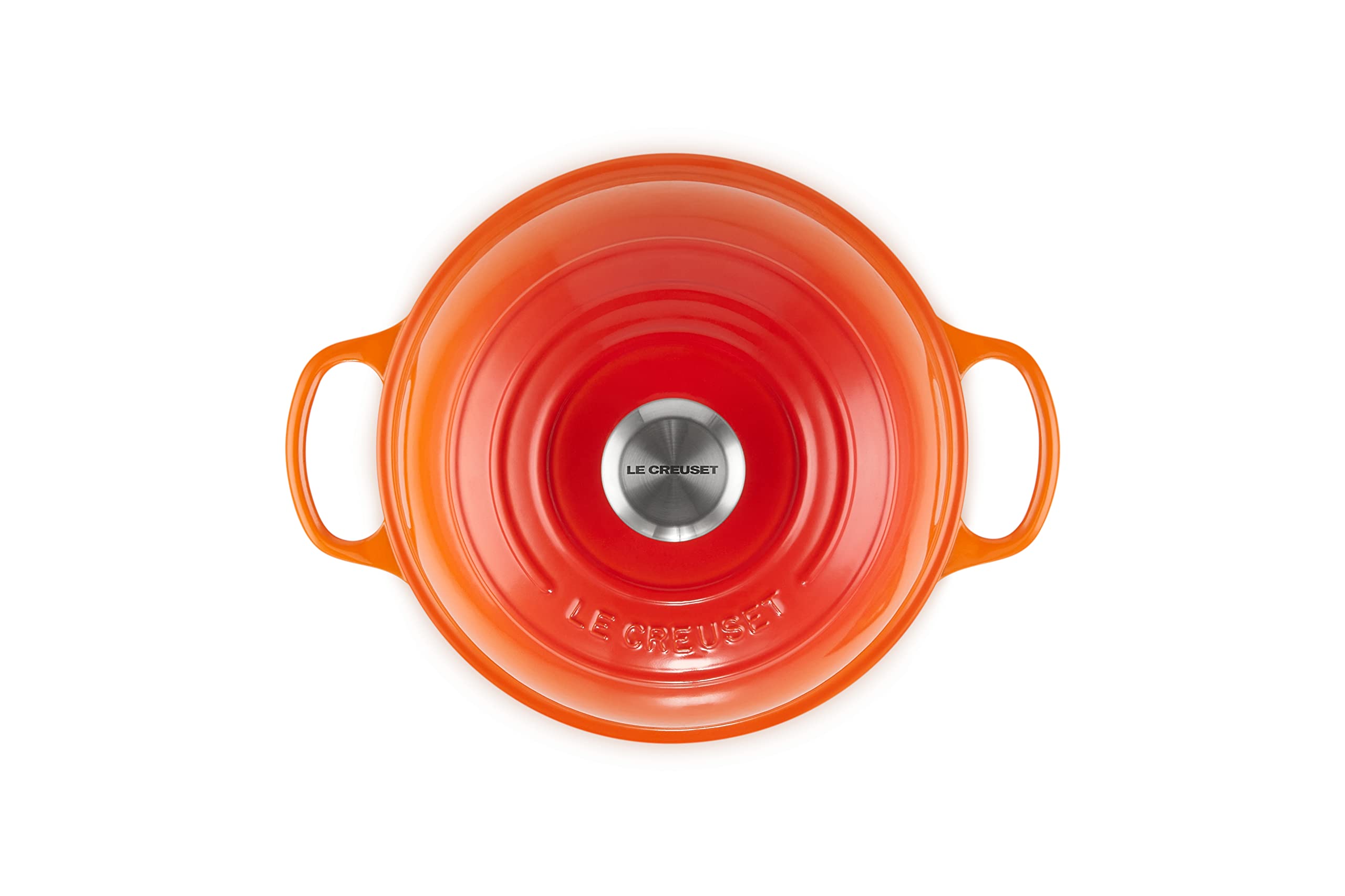 Le Creuset Bread Oven Flame domed lid traps steam for bakery crust.