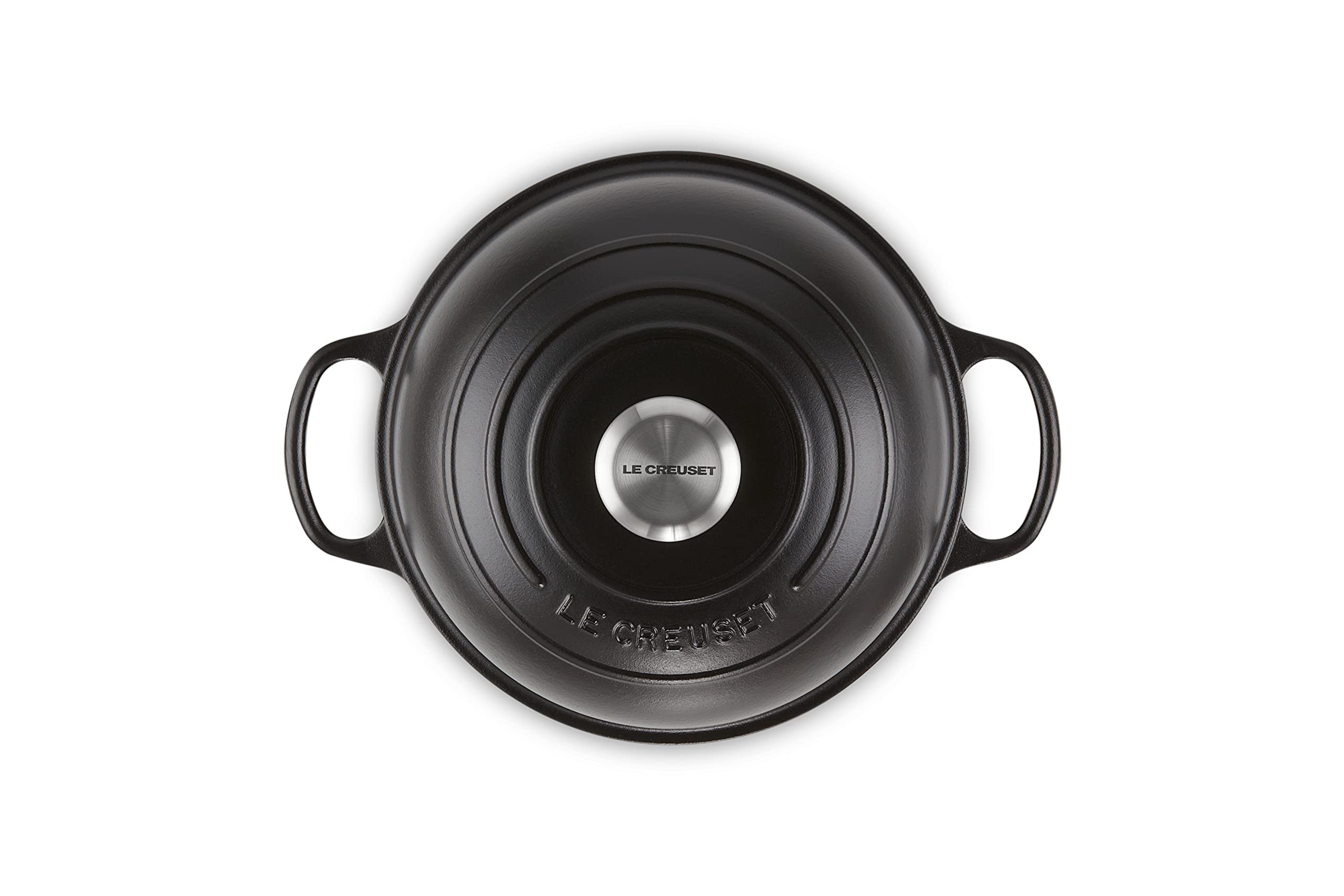 Le Creuset lid traps steam for crisp crust and maximum rise.