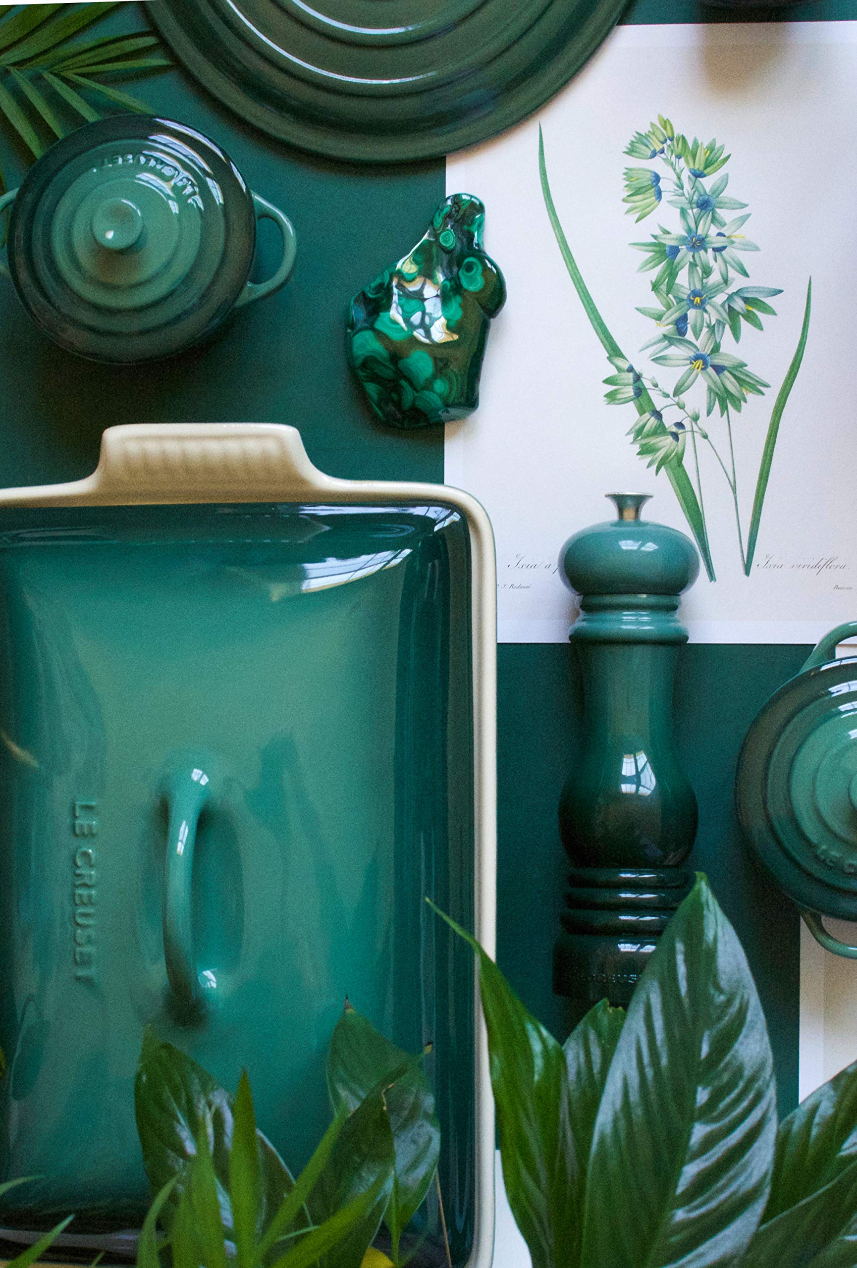 Le Creuset Artichaut butter dish on fridge shelf, moisture-resistant stoneware preserves texture.