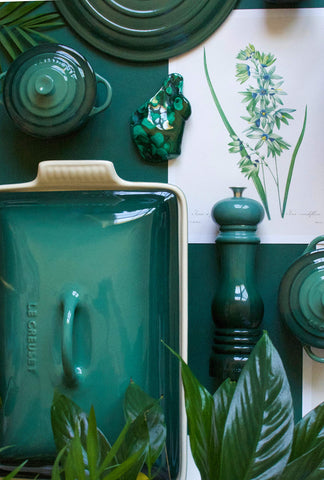 Le Creuset Artichaut butter dish on fridge shelf, moisture-resistant stoneware preserves texture.