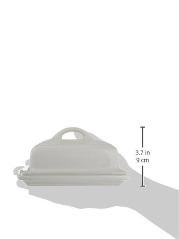 Le Creuset butter dish in fridge holding two sticks of butter.