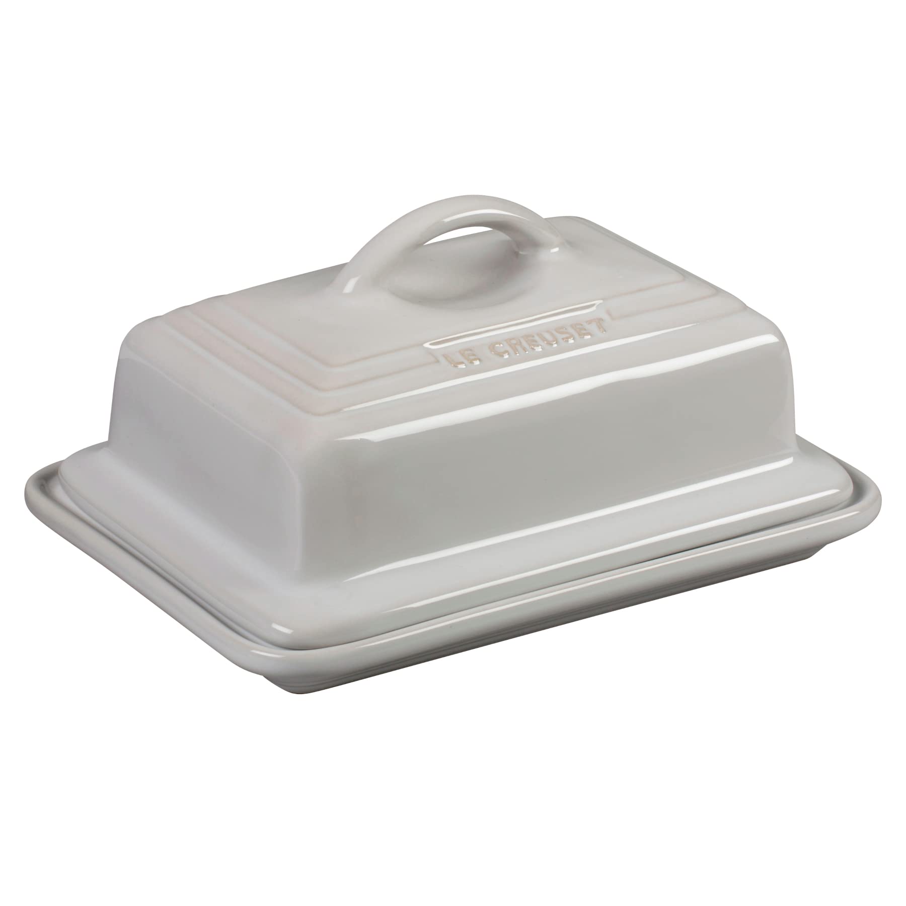 Le Creuset butter dish in white with lid on, ideal for fridge-to-table use.