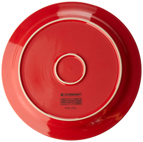 Le Creuset Cerise glaze close-up highlights non-porous, scratch-resistant coating