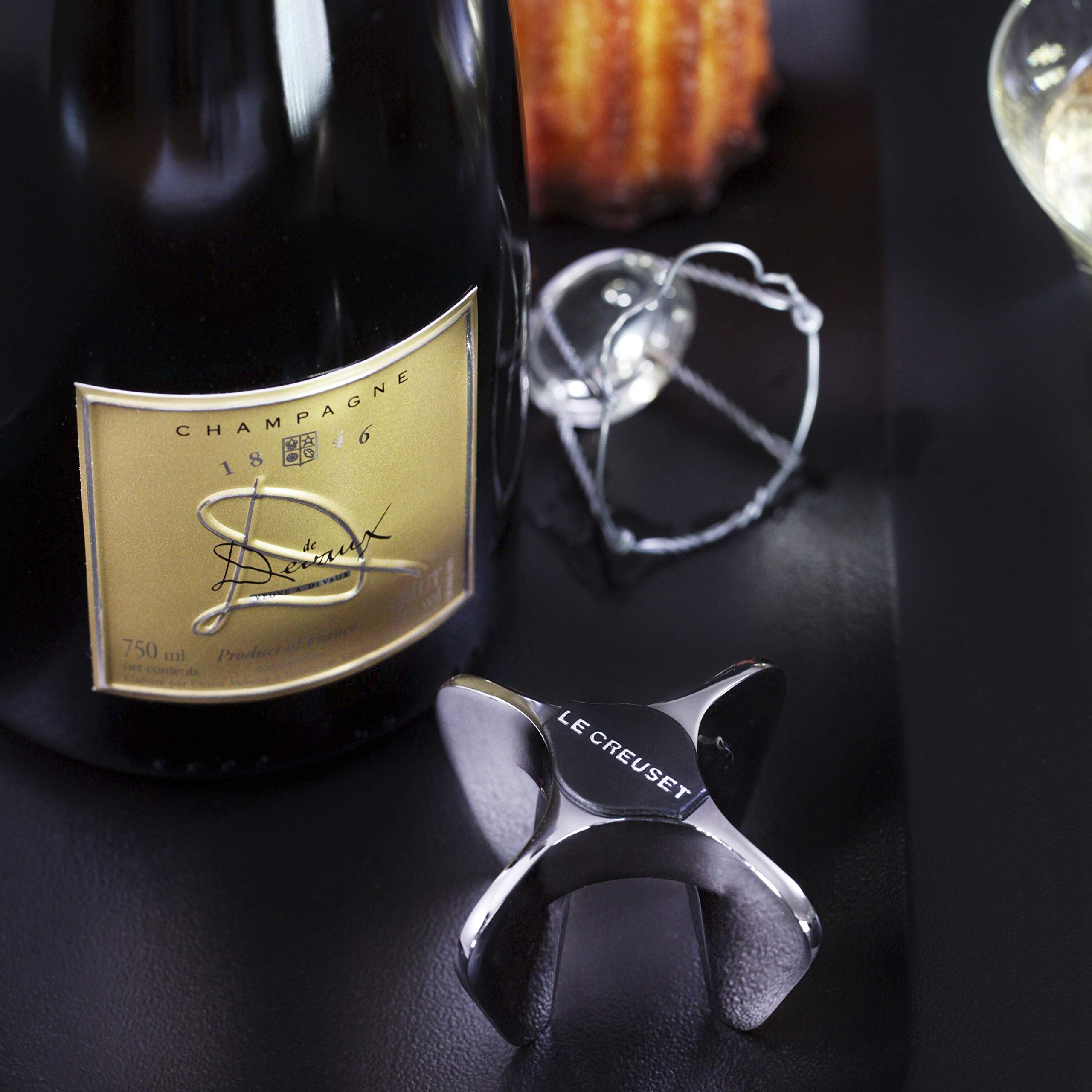 Le Creuset Champagne Star Opener in hand demonstrates secure cork grip.