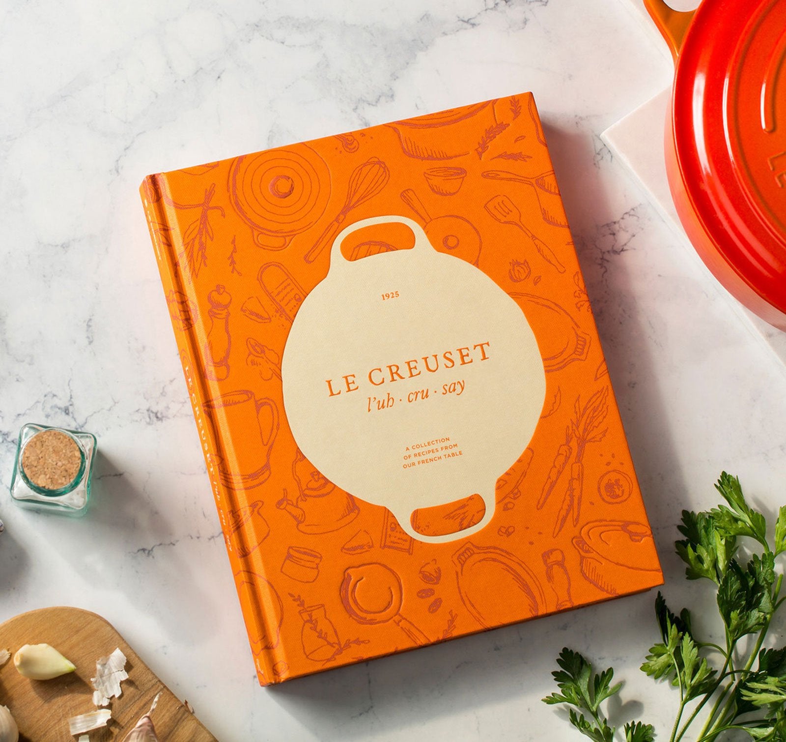 Le Creuset Cookbook with 90+ full color photos encourages kitchen creativity