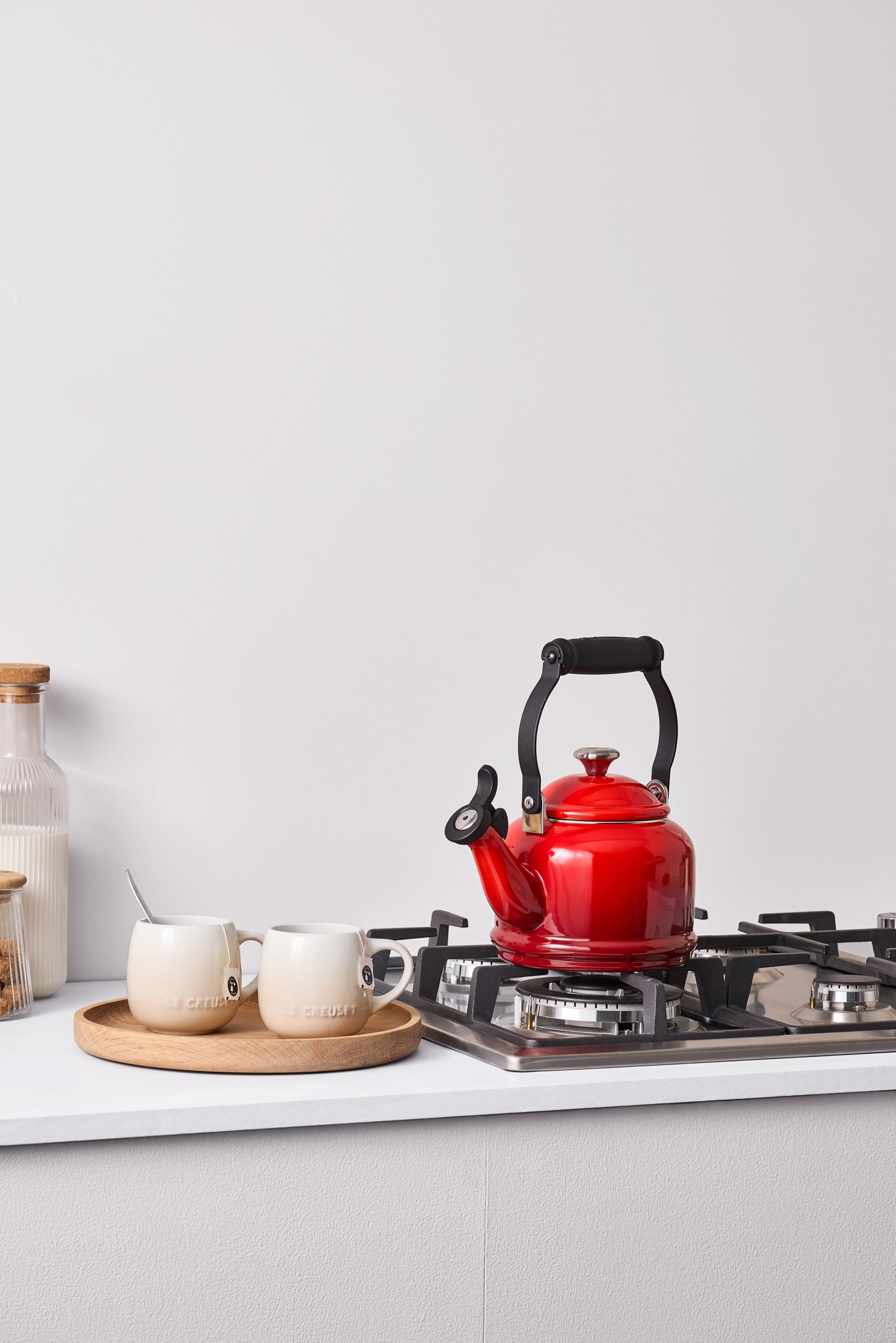 Le Creuset Demi Tea Kettle Cerise knob and handle with cartouche detail.