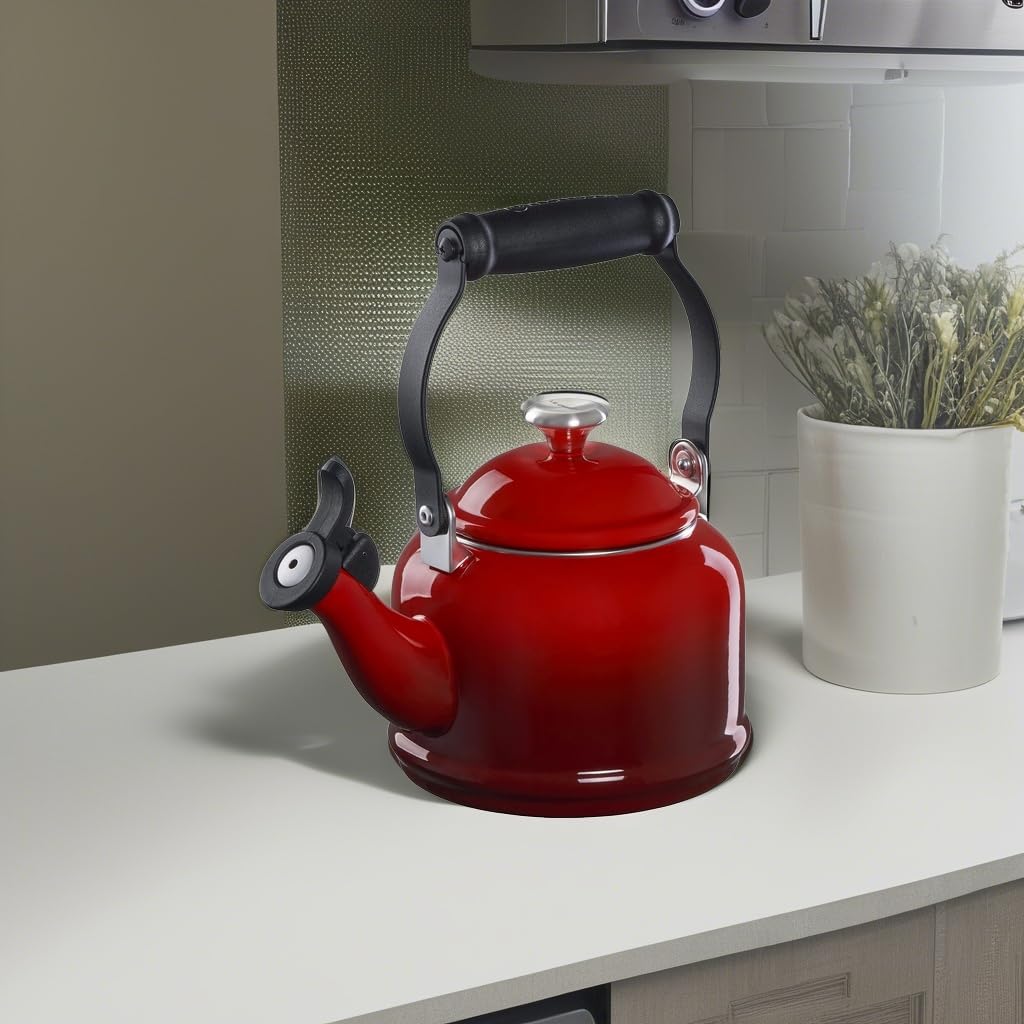 Le Creuset Demi Tea Kettle Cerise on a sunny counter invites contrasting kitchen color.