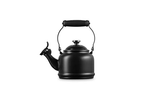 Le Creuset Demi Tea Kettle in Licorice — pour action with comfortable handle.