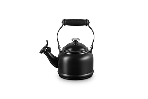 Le Creuset Demi Tea Kettle in Licorice — close-up of fixed whistle signaling boiling.