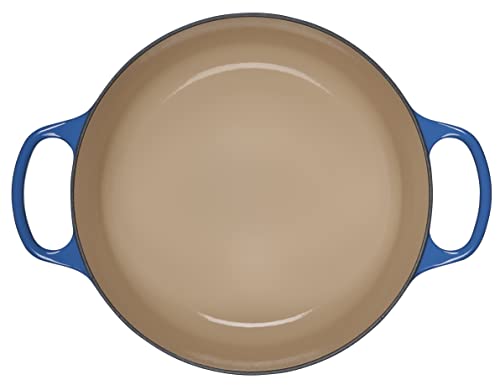 Le Creuset Dutch Oven lid demonstrates steam circulation for moisture retention and even cooking.