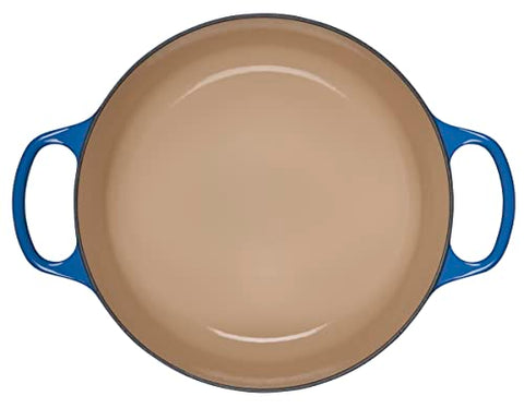 Le Creuset Dutch Oven lid demonstrates steam circulation for moisture retention and even cooking.
