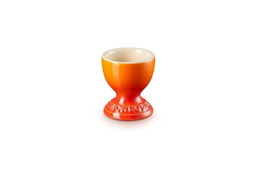 Le Creuset Egg Cup in Flame, side view highlighting ergonomic shape for easy handling