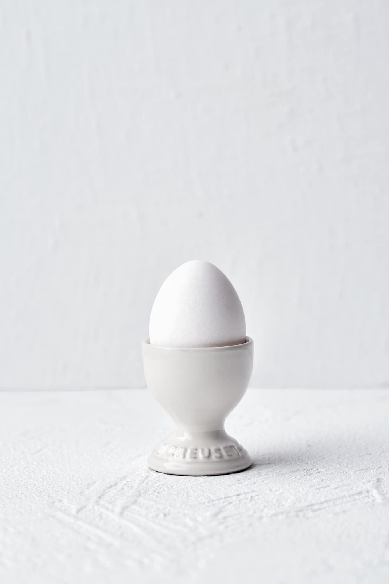 Le Creuset egg cup pairs with desserts for stylish presentation.