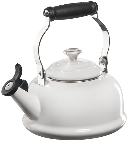 Le Creuset whistling tea kettle front view highlights quick heat and vibrant enamel finish.