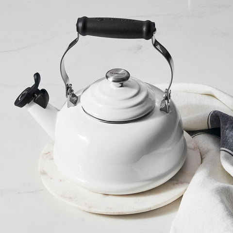 Le Creuset whistling tea kettle knob and handle offer durable grip.