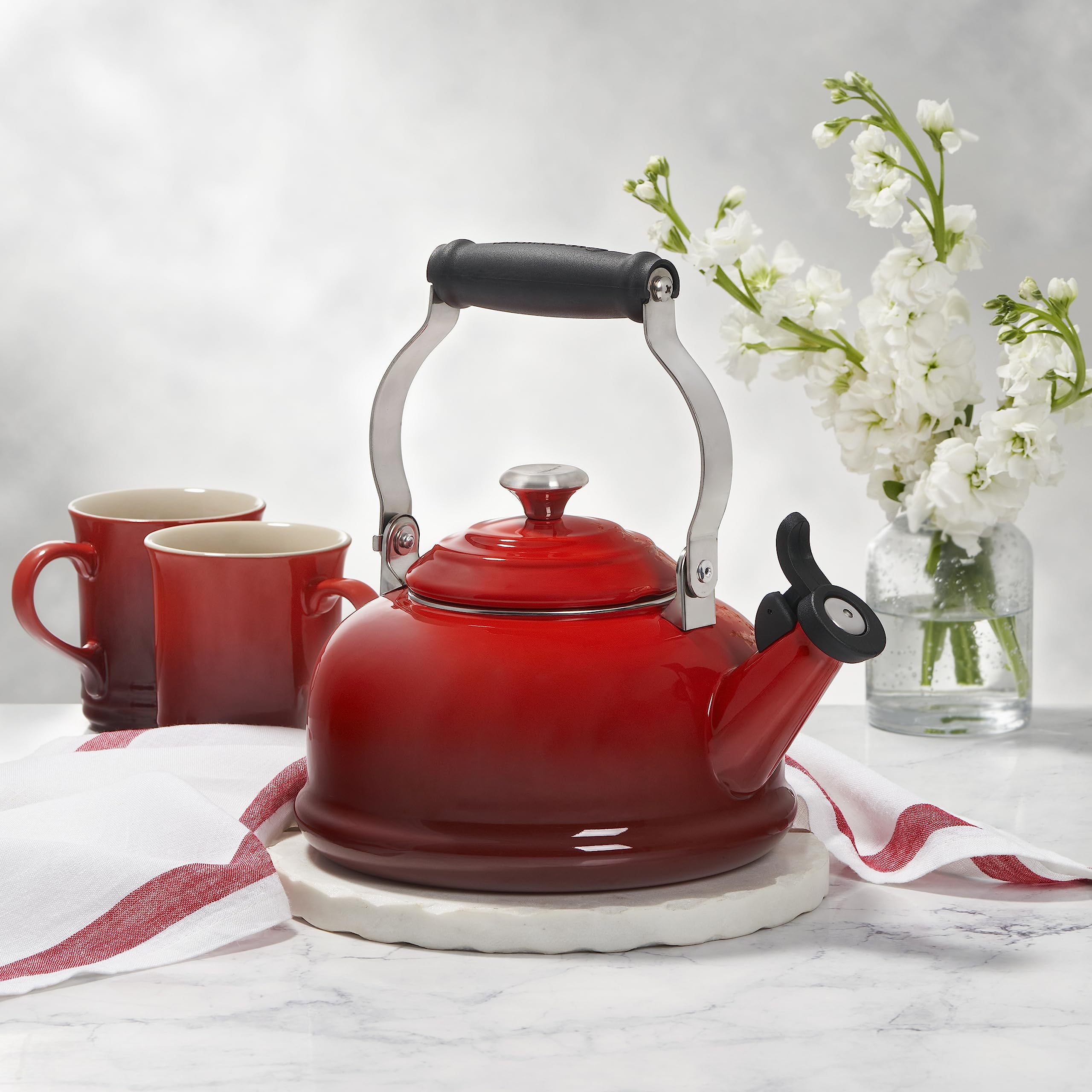 Classic Le Creuset kettle design complements any kitchen style.