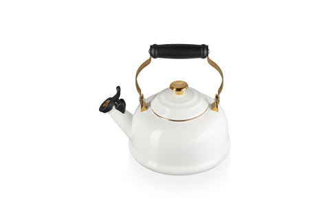 Le Creuset enamel on steel kettle on stove heats water quickly for tea.