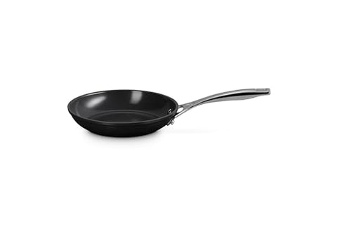 Le Creuset pan handle close-up showing stay-cool grip for comfortable cooking