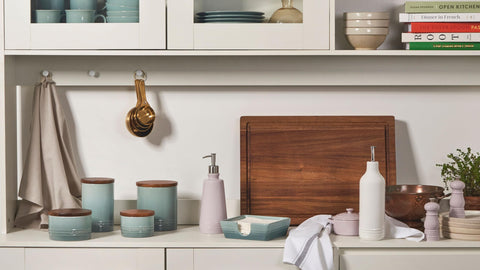 Display of Le Creuset canisters in four sizes for versatile kitchen storage.
