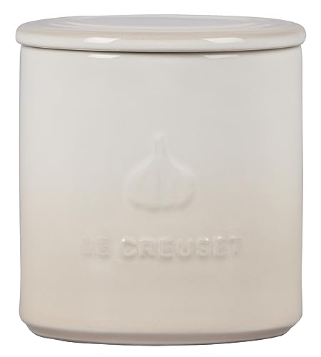 Close-up of Le Creuset garlic keeper base holes showing humidity control.