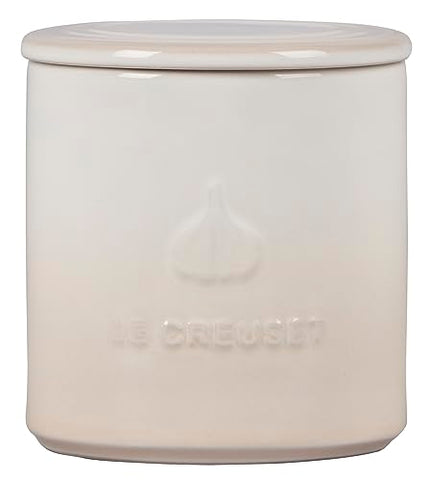 Close-up of Le Creuset garlic keeper base holes showing humidity control.