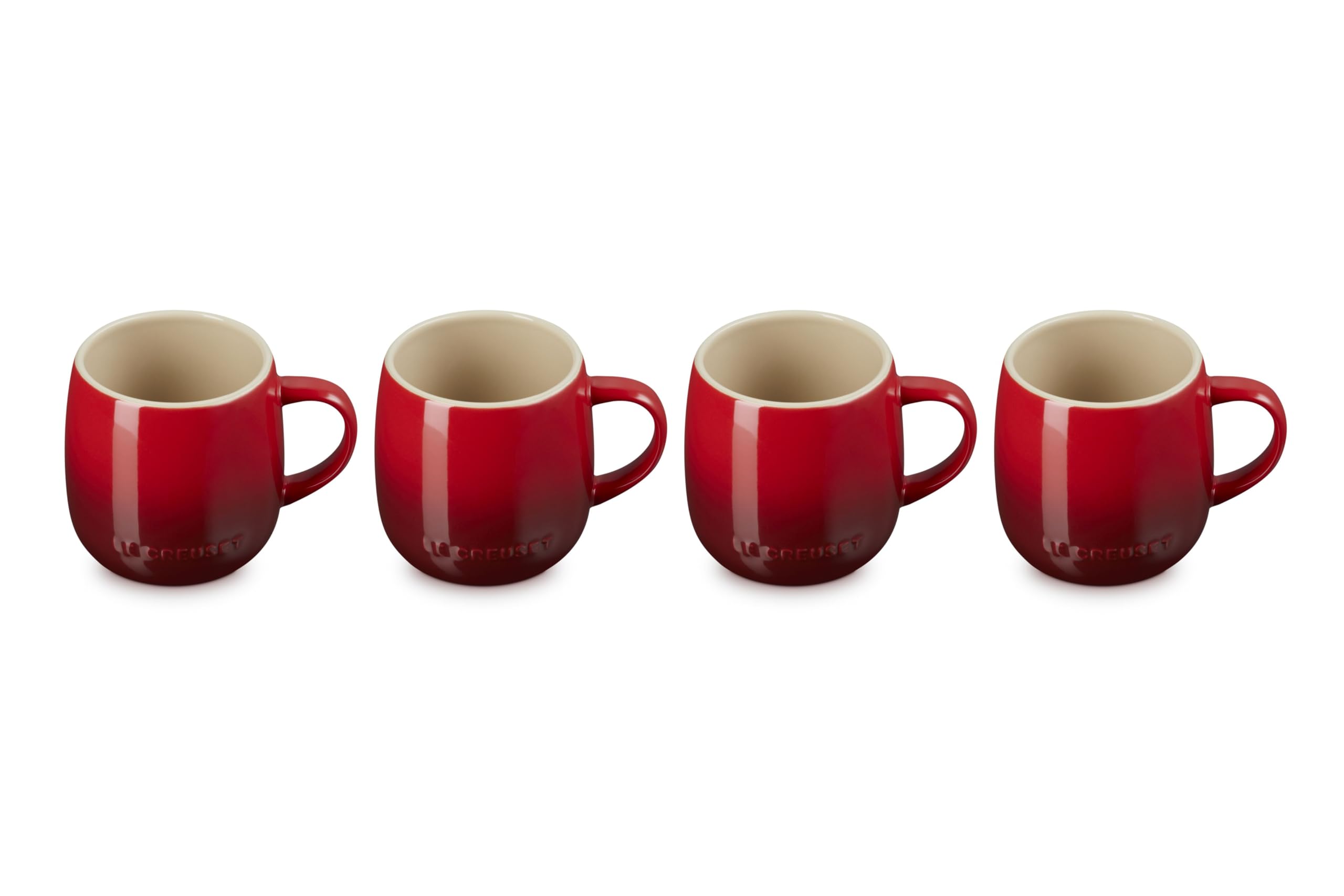 Le Creuset Heritage Mugs Cerise four-pack on a kitchen counter for morning coffee