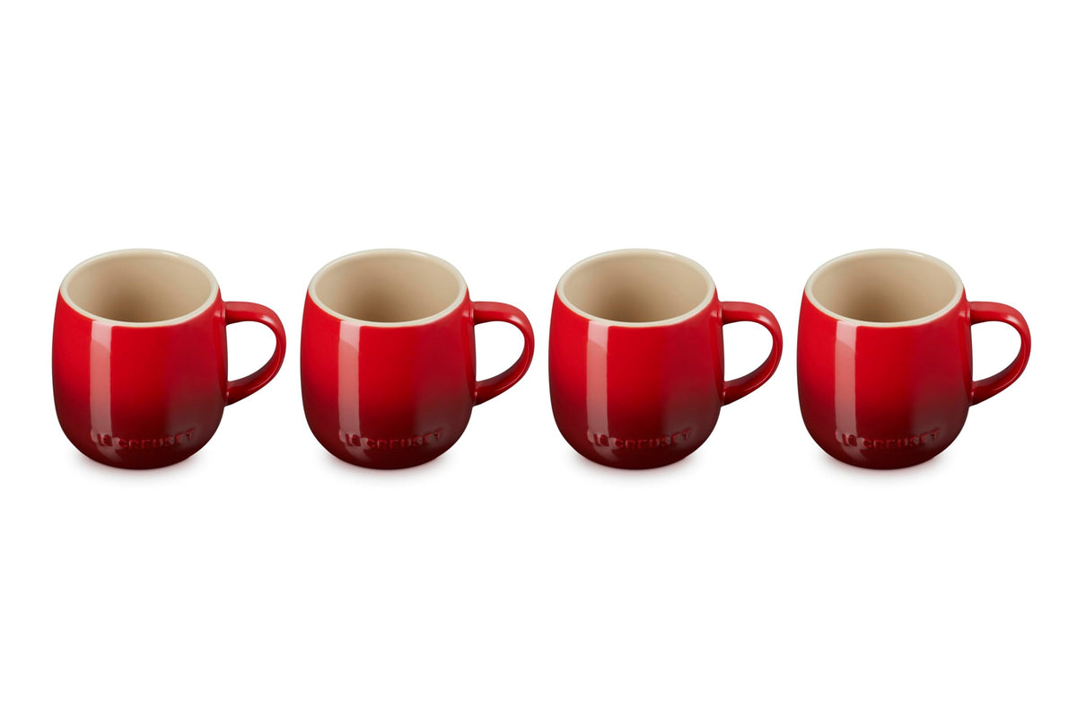 Le Creuset Heritage Mugs Cerise four-pack on a kitchen counter for morning coffee