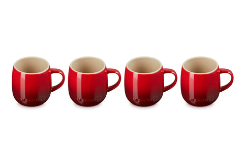 Le Creuset Heritage Mugs Cerise four-pack on a kitchen counter for morning coffee
