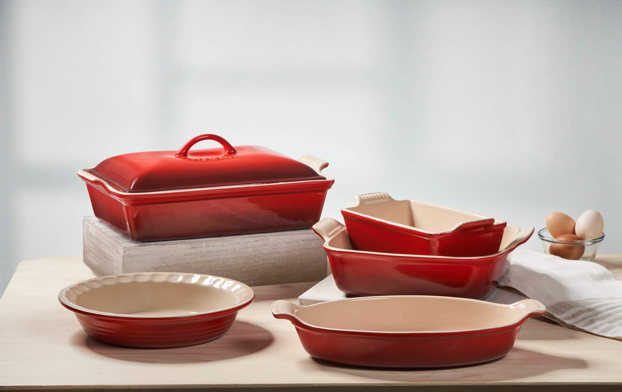 Le Creuset Heritage oval au gratin dish in Cerise with lid for moisture retention during roasting