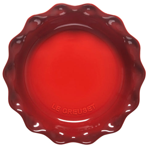 Le Creuset Heritage Pie Dish Cerise highlighting the scalloped edge for elegant slices.
