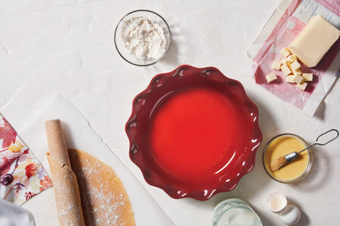 Le Creuset Heritage Pie Dish Cerise shows smooth enamel for easy food release.
