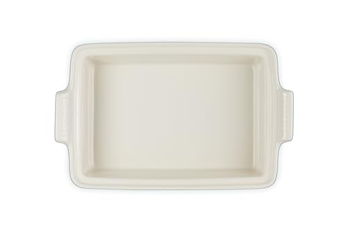 Le Creuset Heritage casserole shown serving from oven to table, versatile for meals.