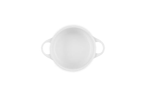 Le Creuset lid secure-fitting demonstrates heat and moisture retention for flavorful results.