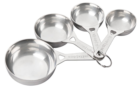 Le Creuset quarter-cup measuring cup for precise dry ingredient measures in baking.