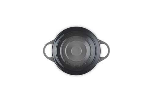 Le Creuset mini round cocotte showing loop handles for transport