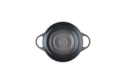 Le Creuset mini round cocotte showing loop handles for transport