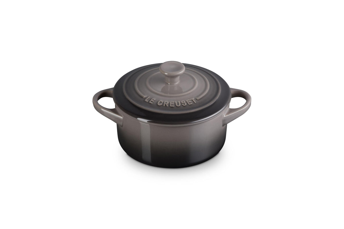 Le Creuset mini round cocotte in oyster, front view, even heat distribution.