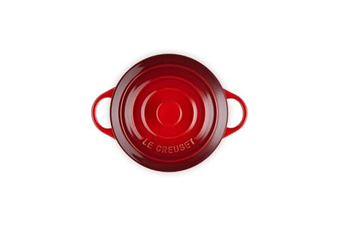 Le Creuset cerise cocotte highlights nonporous glaze resisting stains and flavor transfer