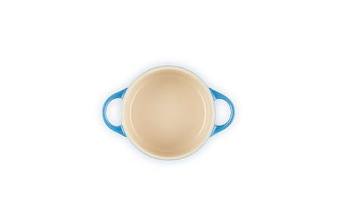 Le Creuset Marseille cocotte interior glaze visible, non-porous surface resists odors and stains.