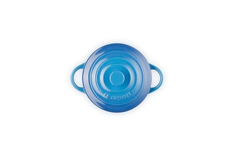 Le Creuset mini round cocotte Marseille with lid on shows heat-trapping design for even cooking.