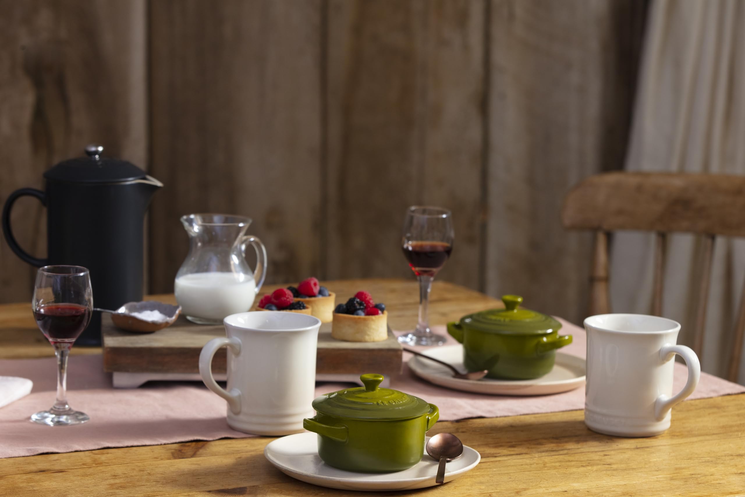 Le Creuset olive cocotte serving warm dishes with style.