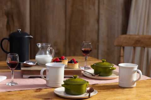Le Creuset olive cocotte serving warm dishes with style.