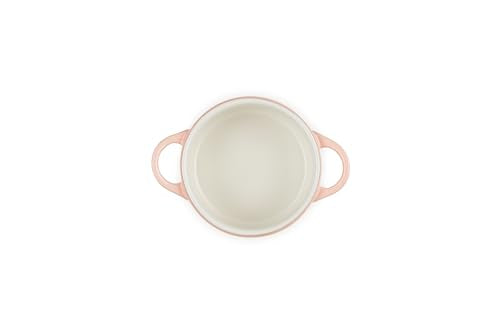 Le Creuset Peche cocotte features a colorful glaze that resists stains.
