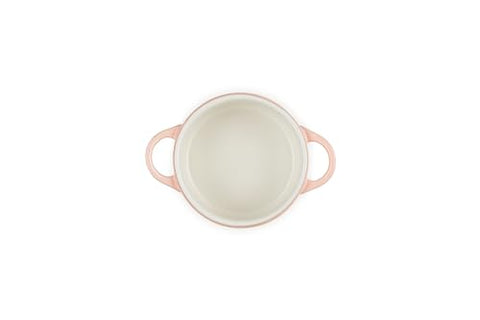 Le Creuset Peche cocotte features a colorful glaze that resists stains.