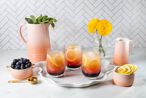Le Creuset Peche cocotte serves as a prep dish or decorative accent.