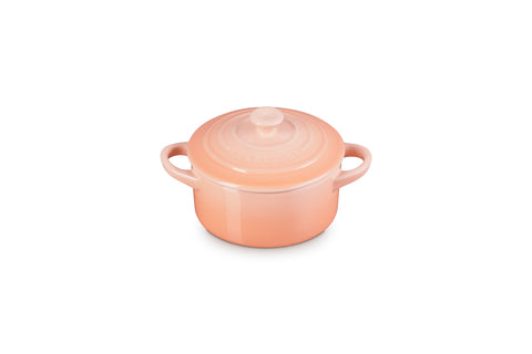 Le Creuset Peche mini cocotte with gold heart knob, ideal for gifting desserts.